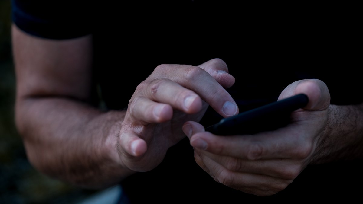 A collector watching a live diecast show on their phone