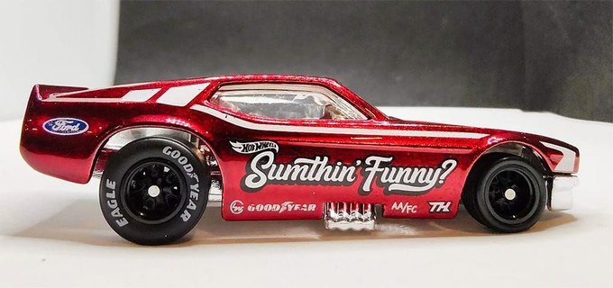 A red Hot Wheels 'Sumthin' Funny?' Mustang Funny Car Super Treasure Hunt with Spectraflame paint